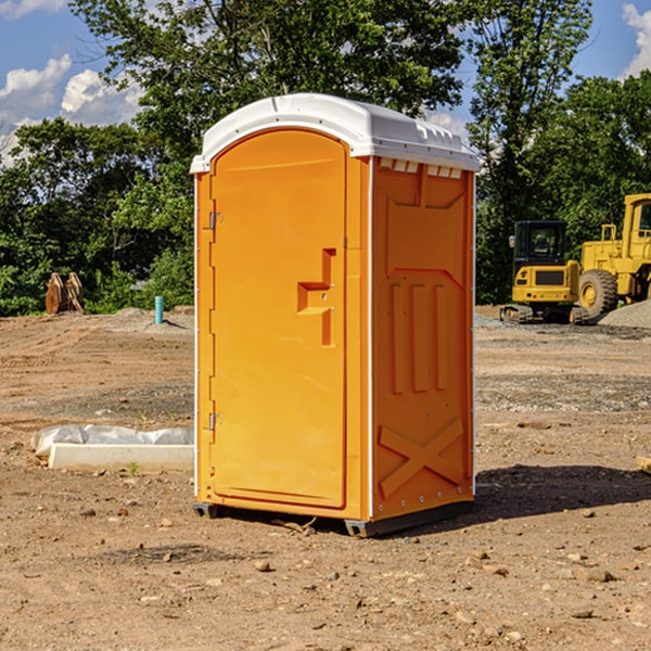 what is the cost difference between standard and deluxe portable restroom rentals in Casco